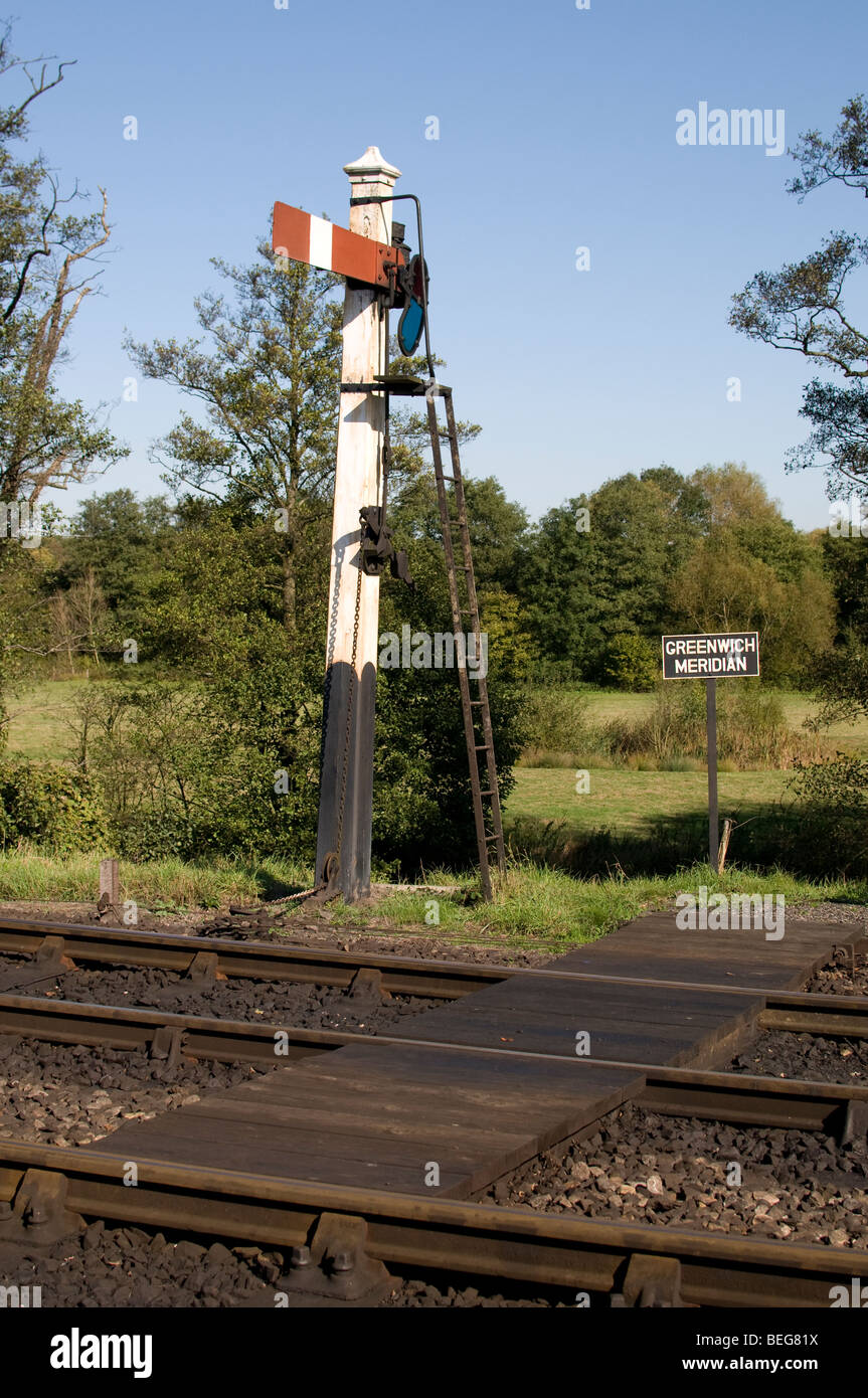 Greenwich Meridian marker next to a railway line. Stock Photo