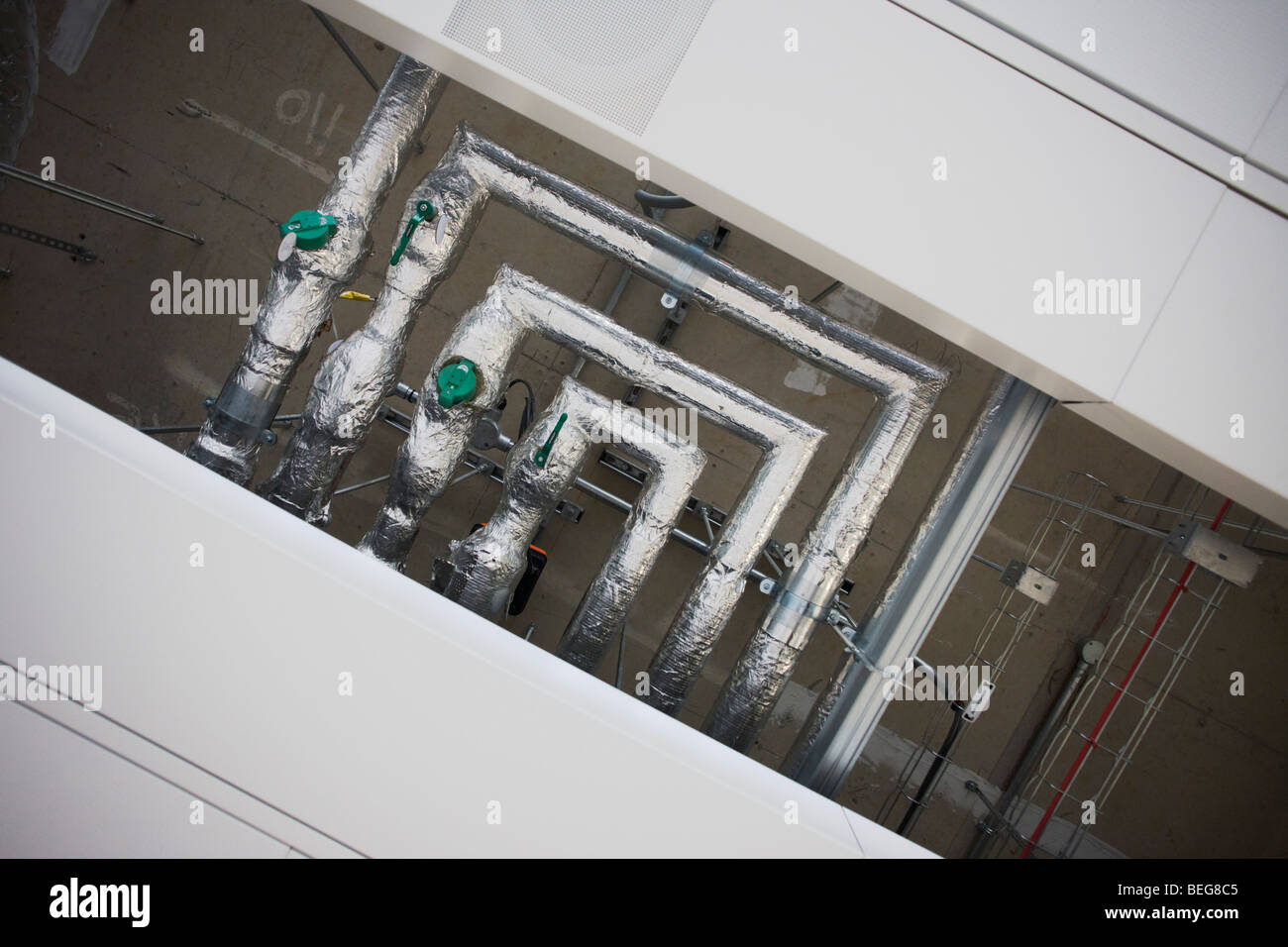 Internal piping and wiring exposed by design in ceiling at Heathrow