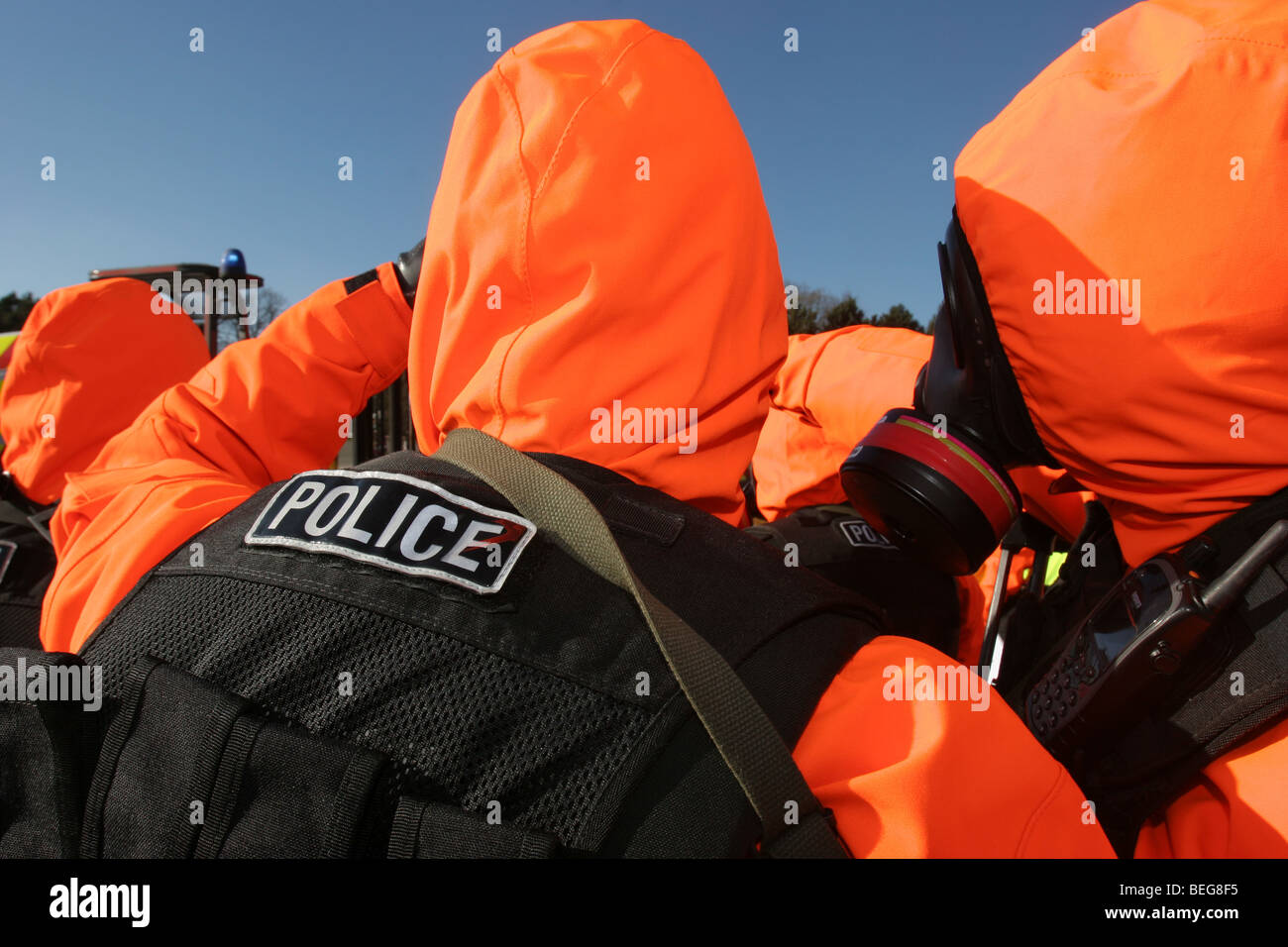 Police anti-nuclear chemical warfare suits Stock Photo
