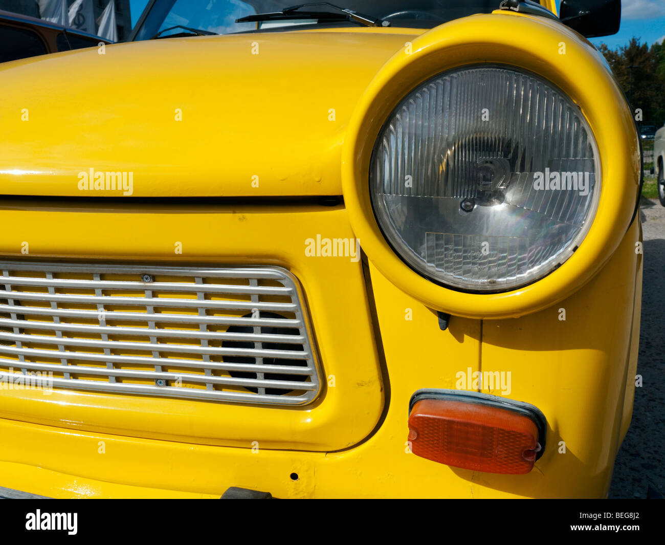 Old East German era  yellow Trabant car in Berlin Germany Stock Photo