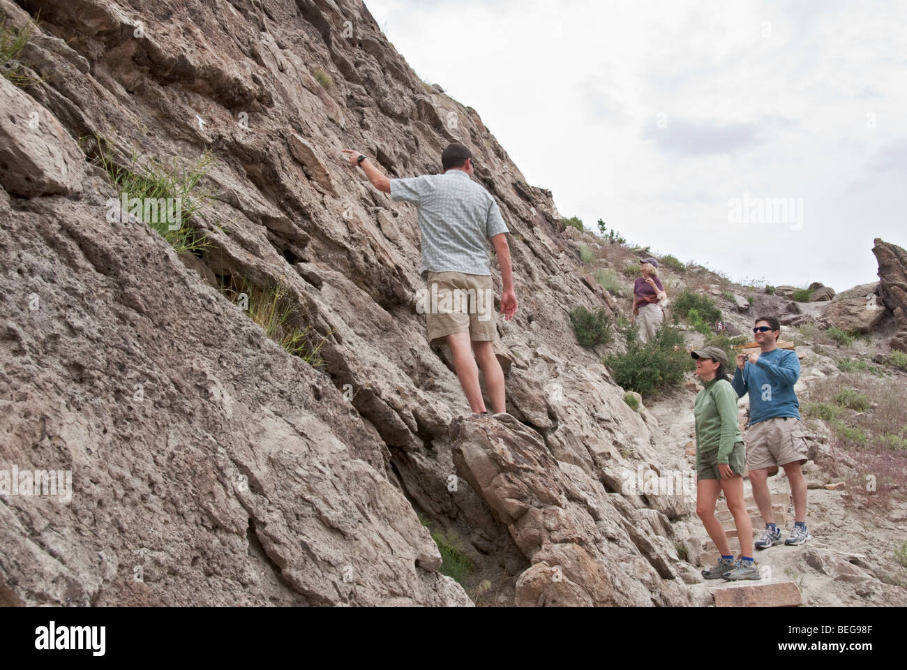 Colorado Dinosaur National Monument Fossil Discovery Trail white arrow points to bone fragment Stock Photo
