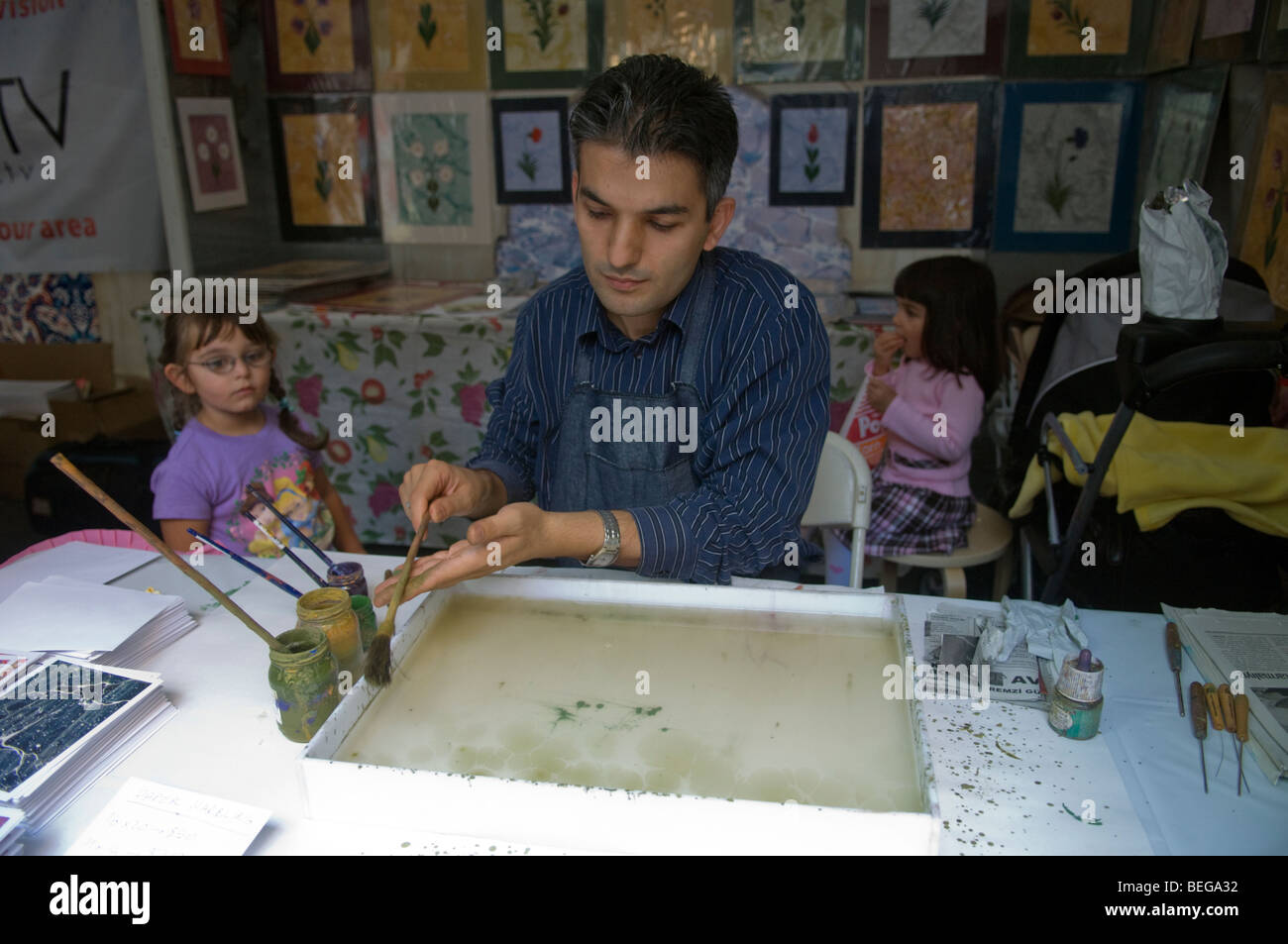 An artist demonstrates Turkish paper marbling Stock Photo