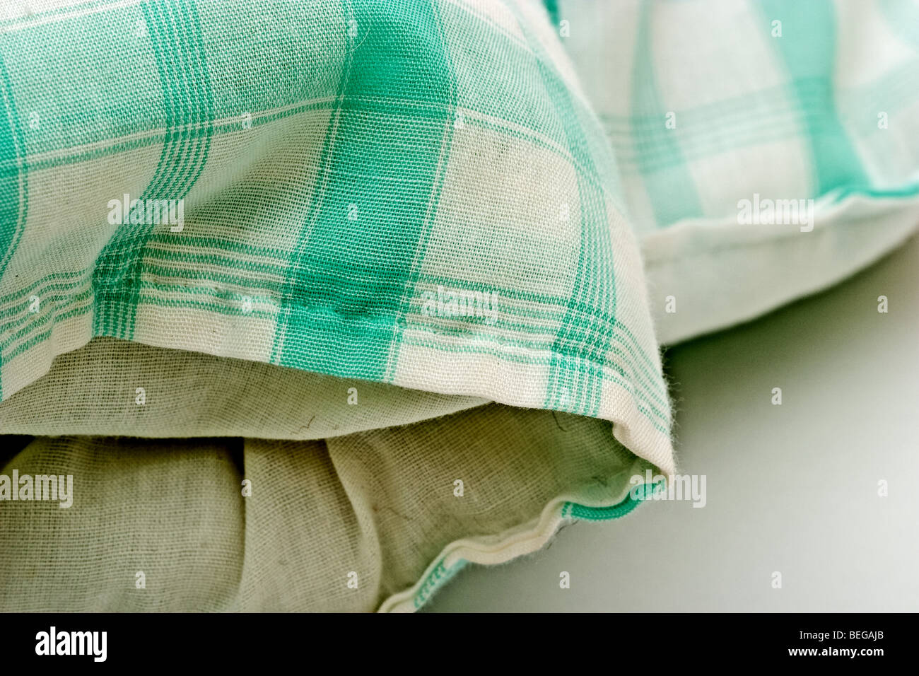 White and green plaid patterned quilt blanket Stock Photo