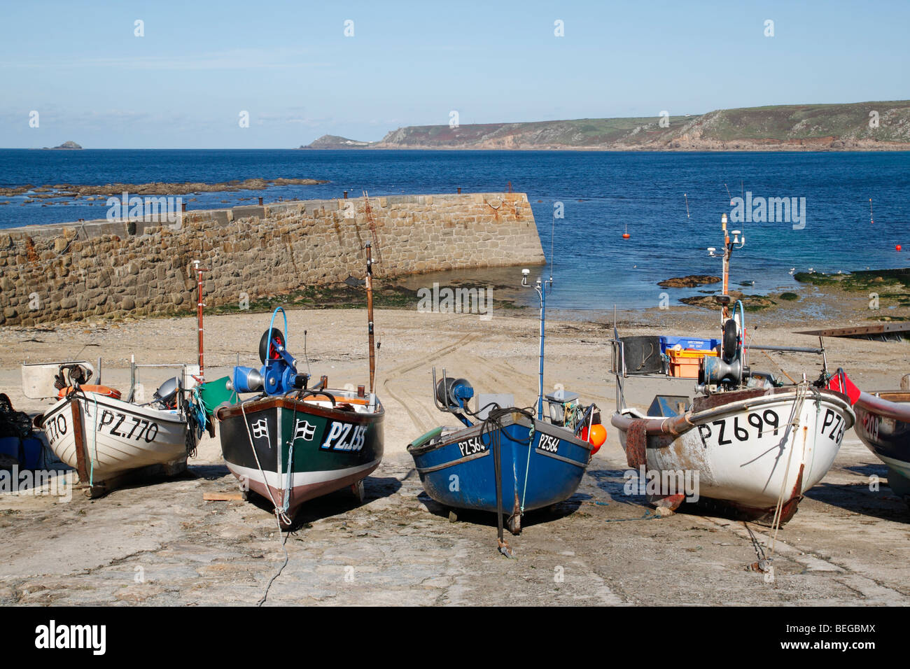 Cornish fishing boats in Sennen Cove harbour at low tide, Cornwall England UK. Stock Photo