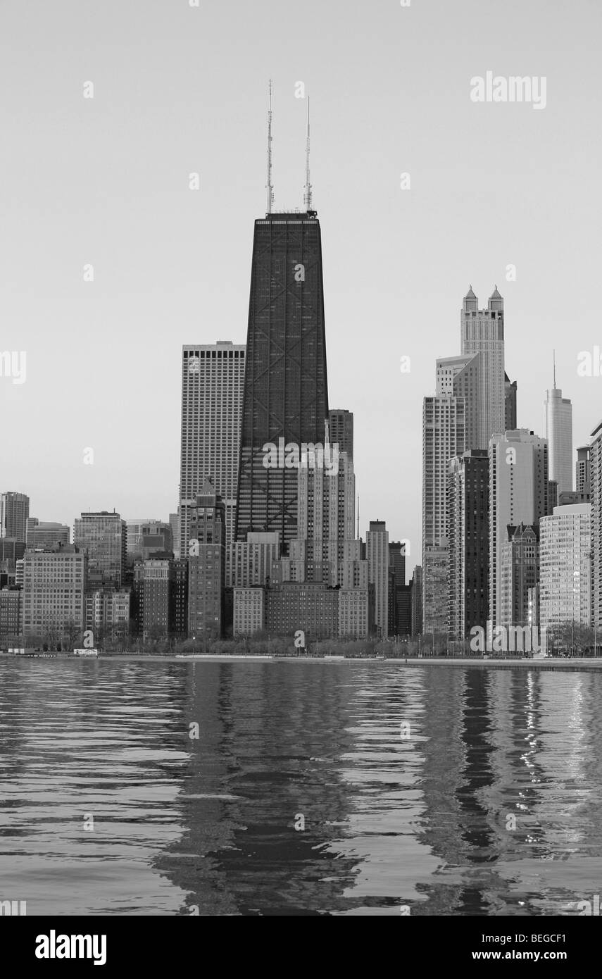 Downtown Chicago Illinois city skyline in the early light of dawn with Lake Michigan water reflection cityscape Stock Photo