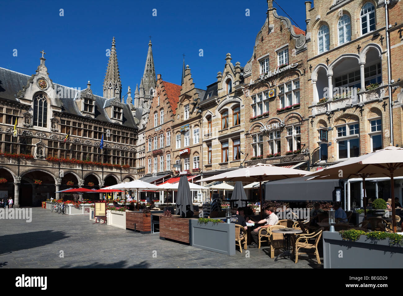 Flemish gabled buildings with restaurants in Grote Markt, next to the Cloth Halls. Stock Photo