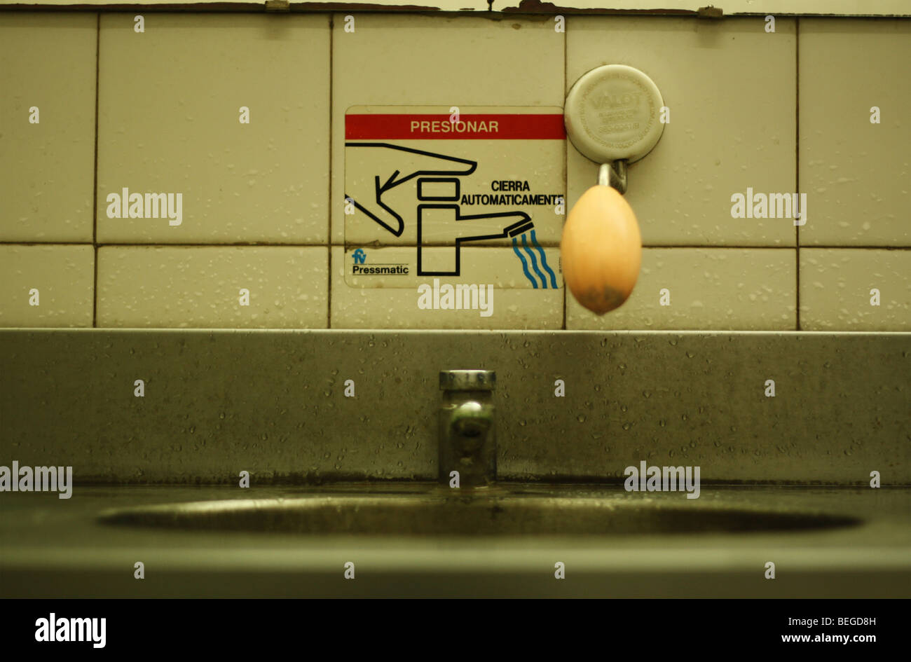 The faucet of a public bathroom Stock Photo - Alamy