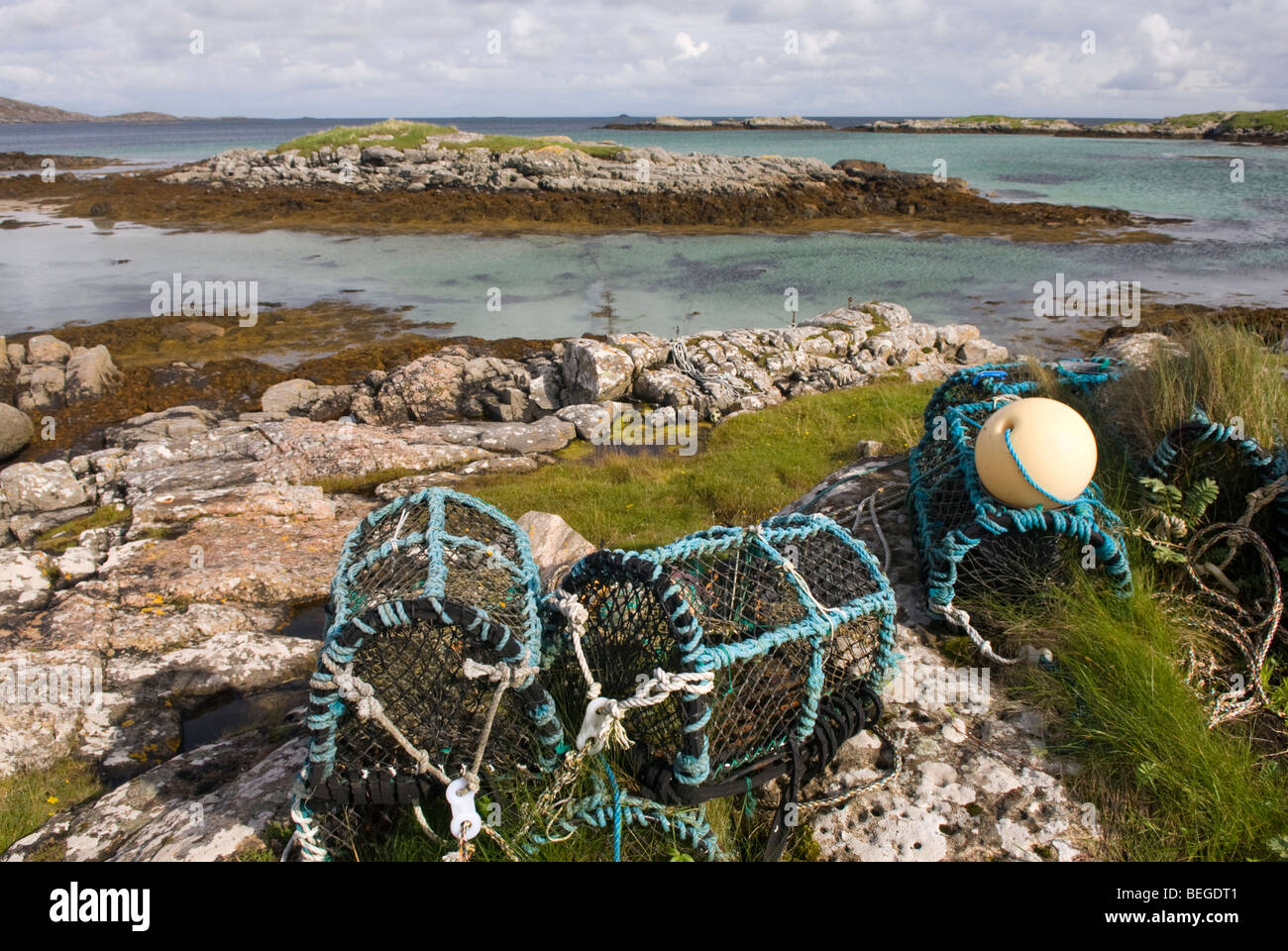 Lobster creels on the rocky coast at Earsairidh, the Isle of Barra, Outer Hebrides, Scotland. Stock Photo