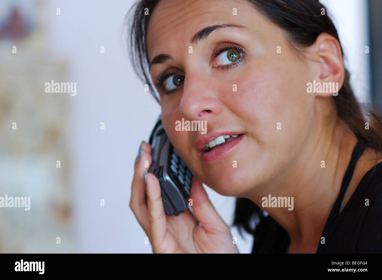 Calling young women,watching,smiling Stock Photo