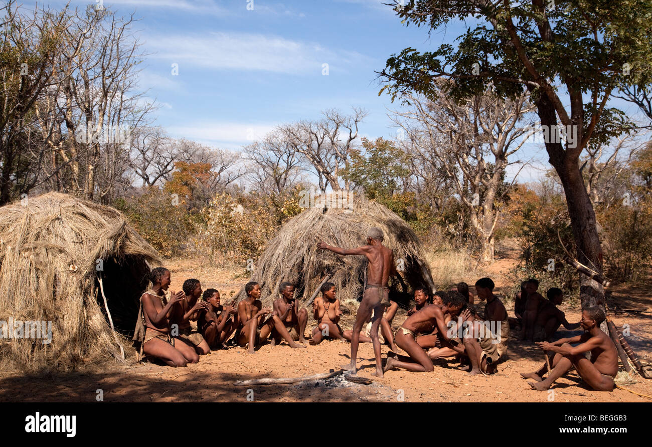 San village in Namiba on the edge of the Kalahari desert. The farewell dance, a hunter prepares to go out into the bush to hunt Stock Photo