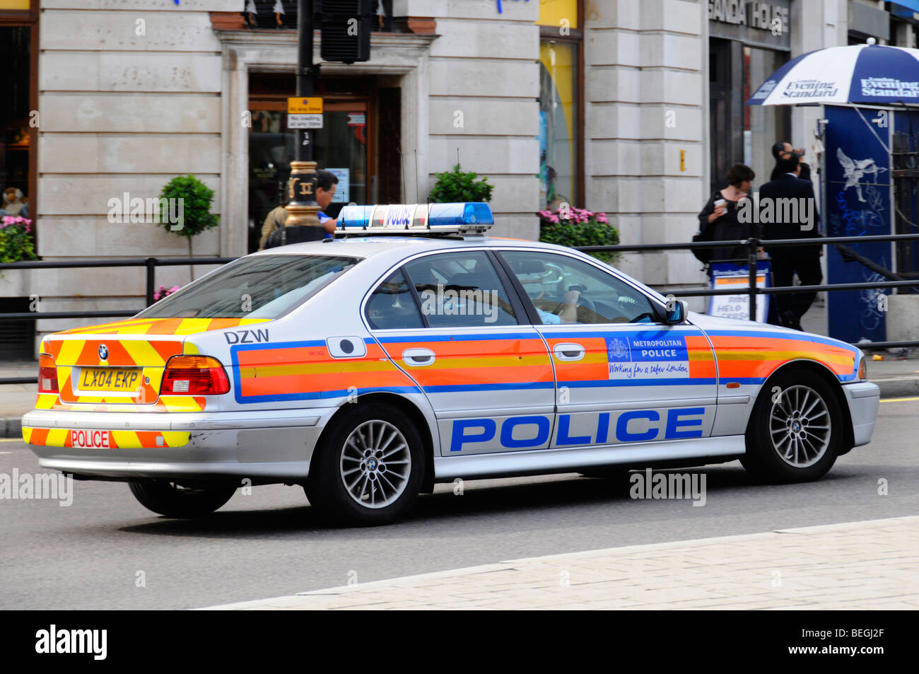 Police car at speed in Trafalgar Square Stock Photo