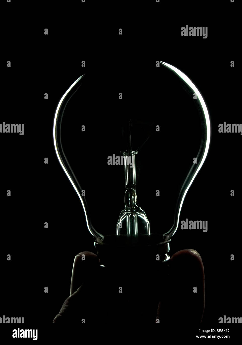 Light bulb in man's hand on white background isolated Stock Photo - Alamy