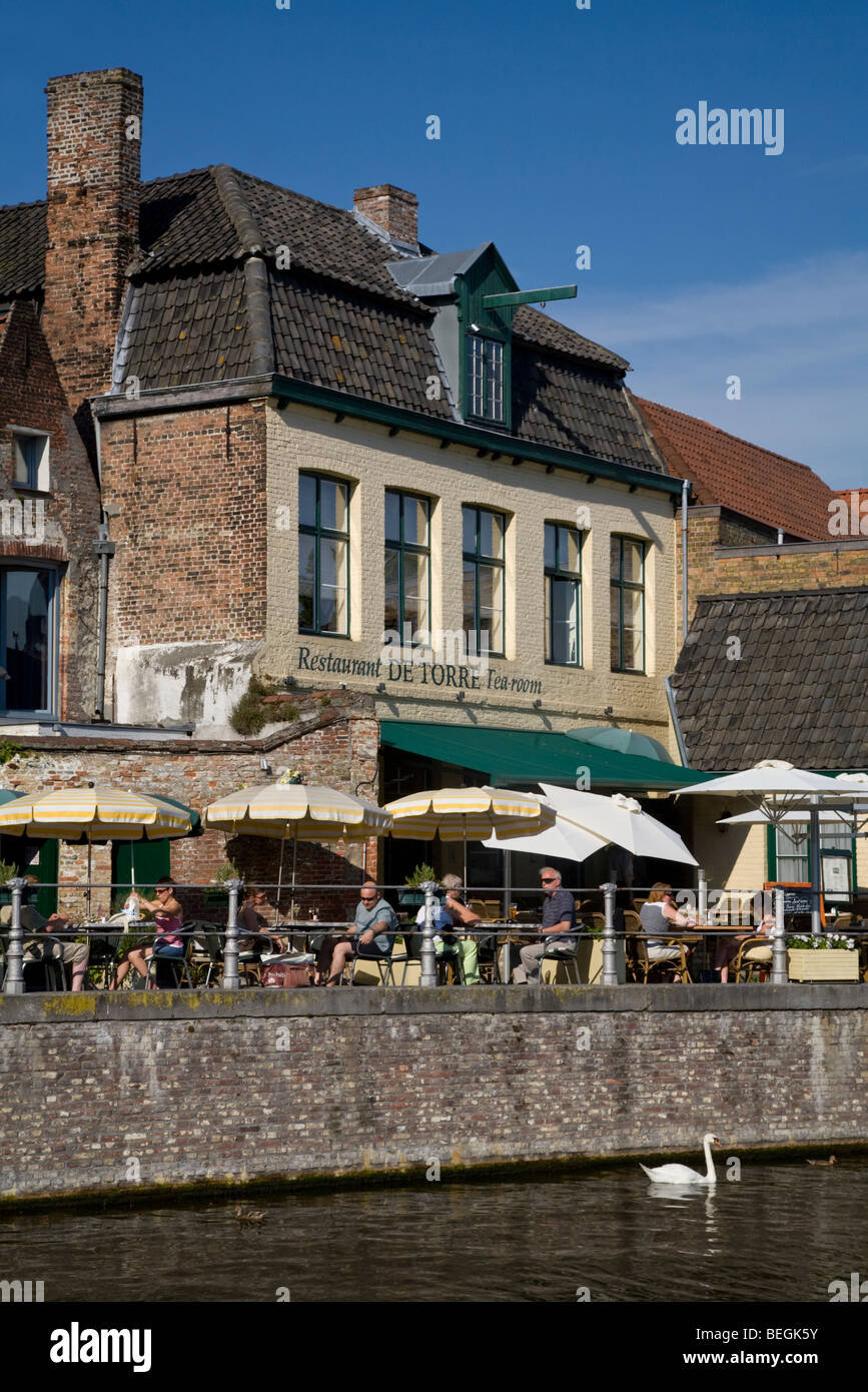 Tourists dining at De Torre restaurant and tea room Bruges, Belgium
