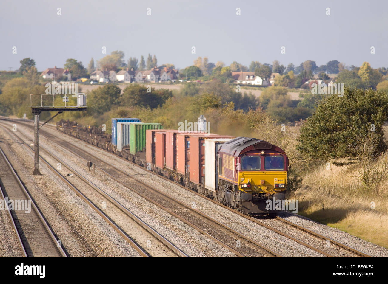 EWS/DBS Class 66 diesel locomotive No. 66141 with an intermodal freight at Cholsey in the Thames Valley. Stock Photo