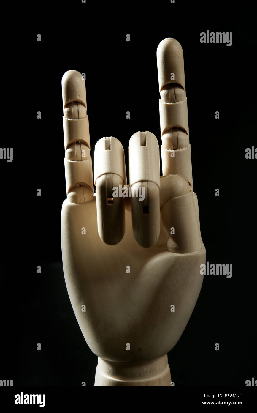 Mannequin wooden hand, horns with two fingers offensive rude gesture