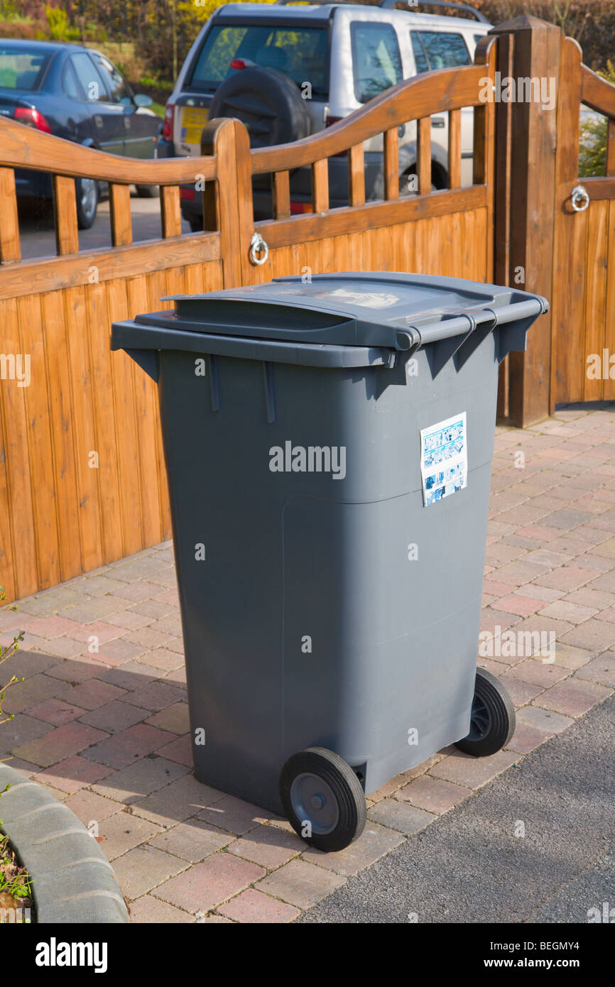 Wheelie bin outside house waiting for refuse collection Stock Photo