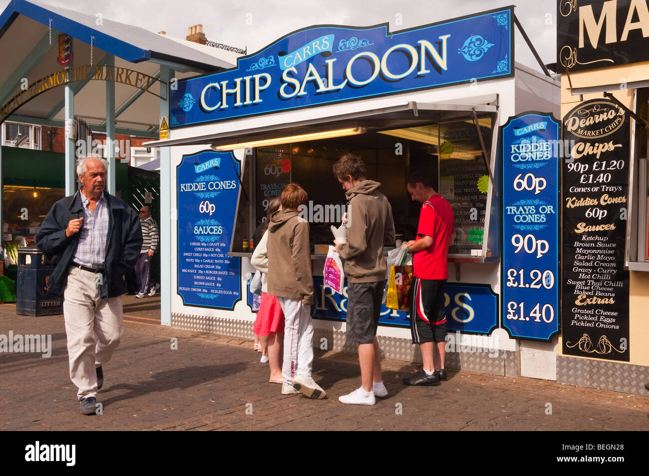 People eating chips from a chip stall ( carrs chip saloon ) at the