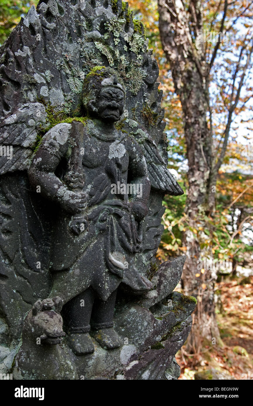 Ancient stone carved warrior at Komein, Togakushi, Japan Stock Photo