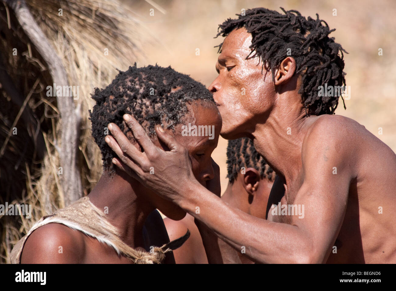 San village in Namiba on the edge of the Kalahari desert. The farewell dance, a hunter prepares to go out into the bush to hunt Stock Photo