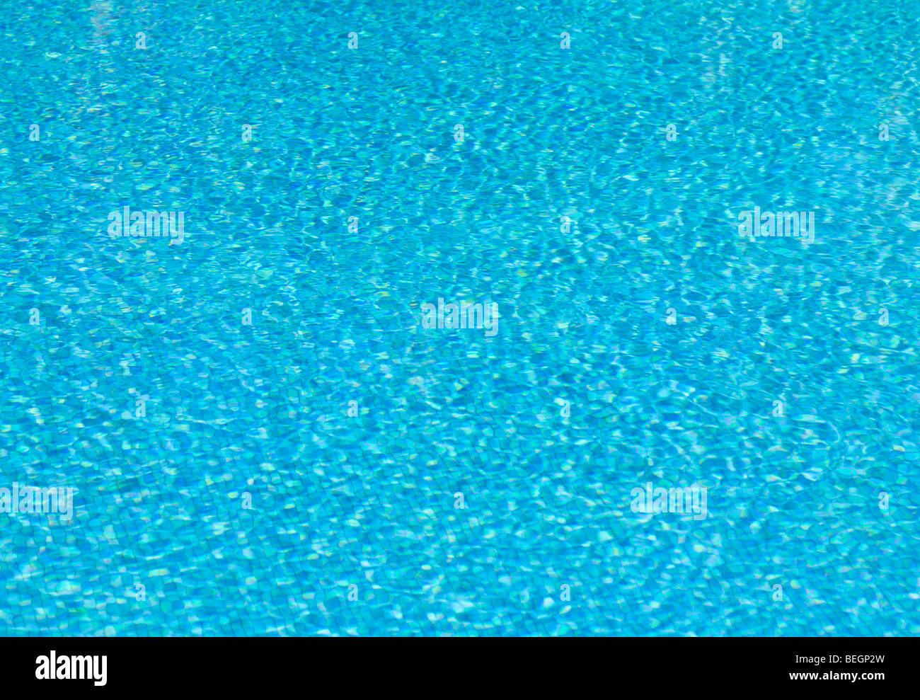 Blue tiles and ripples of water in a 'swimming pool' Stock Photo