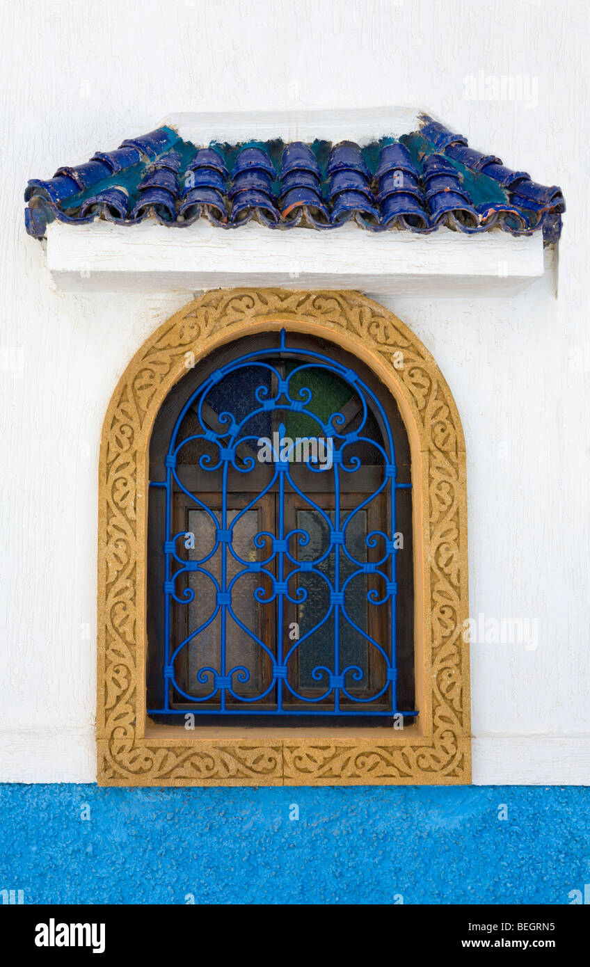 Window with blue wrought iron painted grill Oudaya Kasbah Rabat Morocco Stock Photo