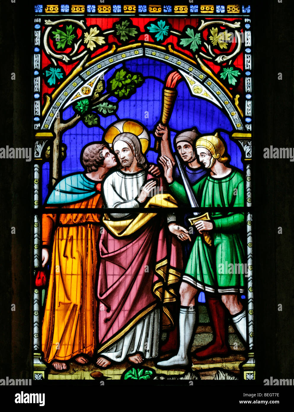 A stained glass window by William Warrington depicting the betrayal of Jesus Christ by Judas Iscariot,  St Mary the Virgin Church, Gunthorpe, Norfolk Stock Photo