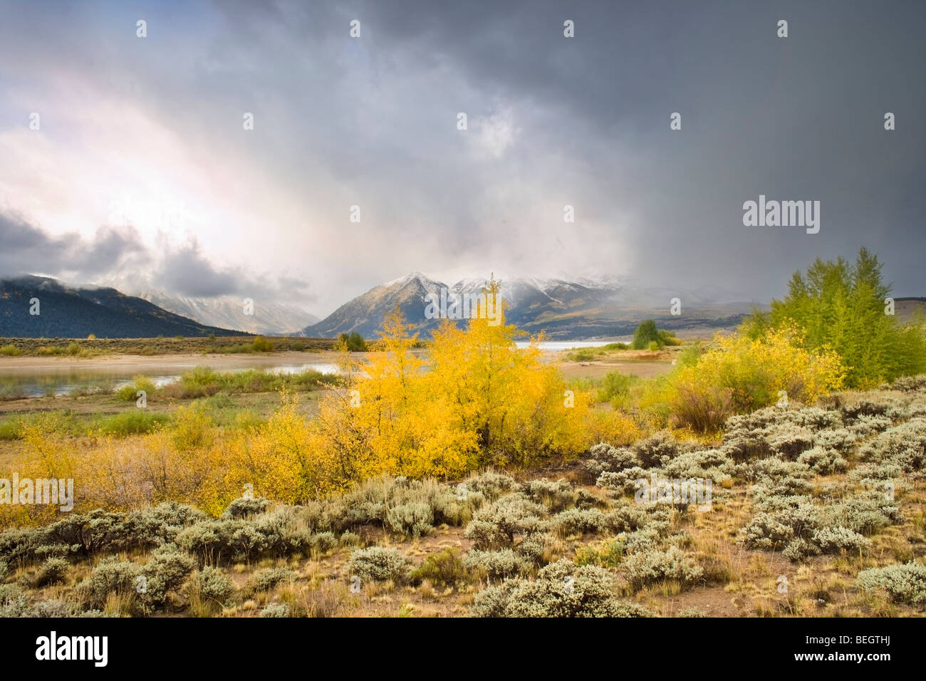Storm over Twin Lake in Colorado near Aspen with trees displaying full autumn and fall colours Stock Photo