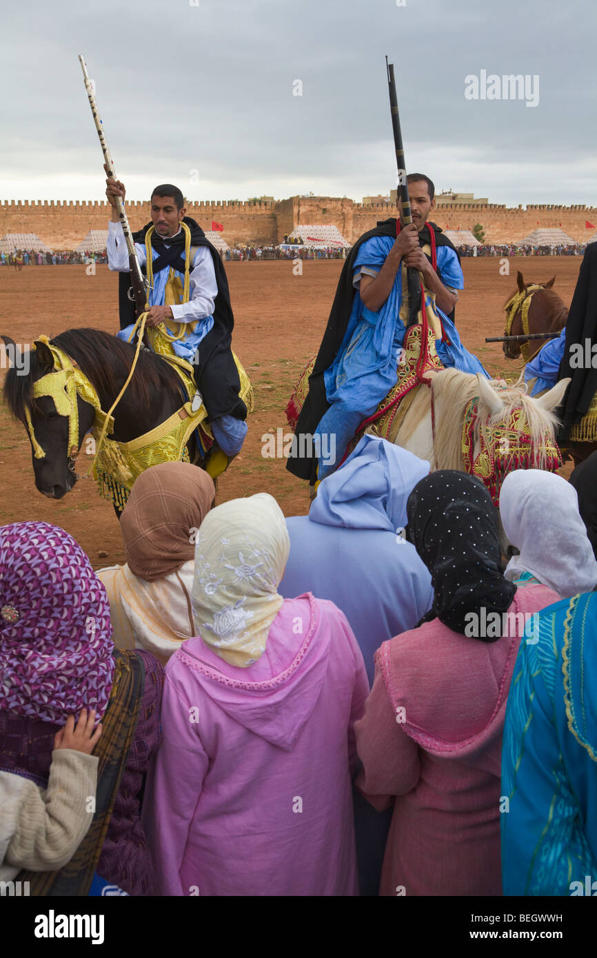 Women watching Festival of Fantasia Meknes Morocco Stock Photo