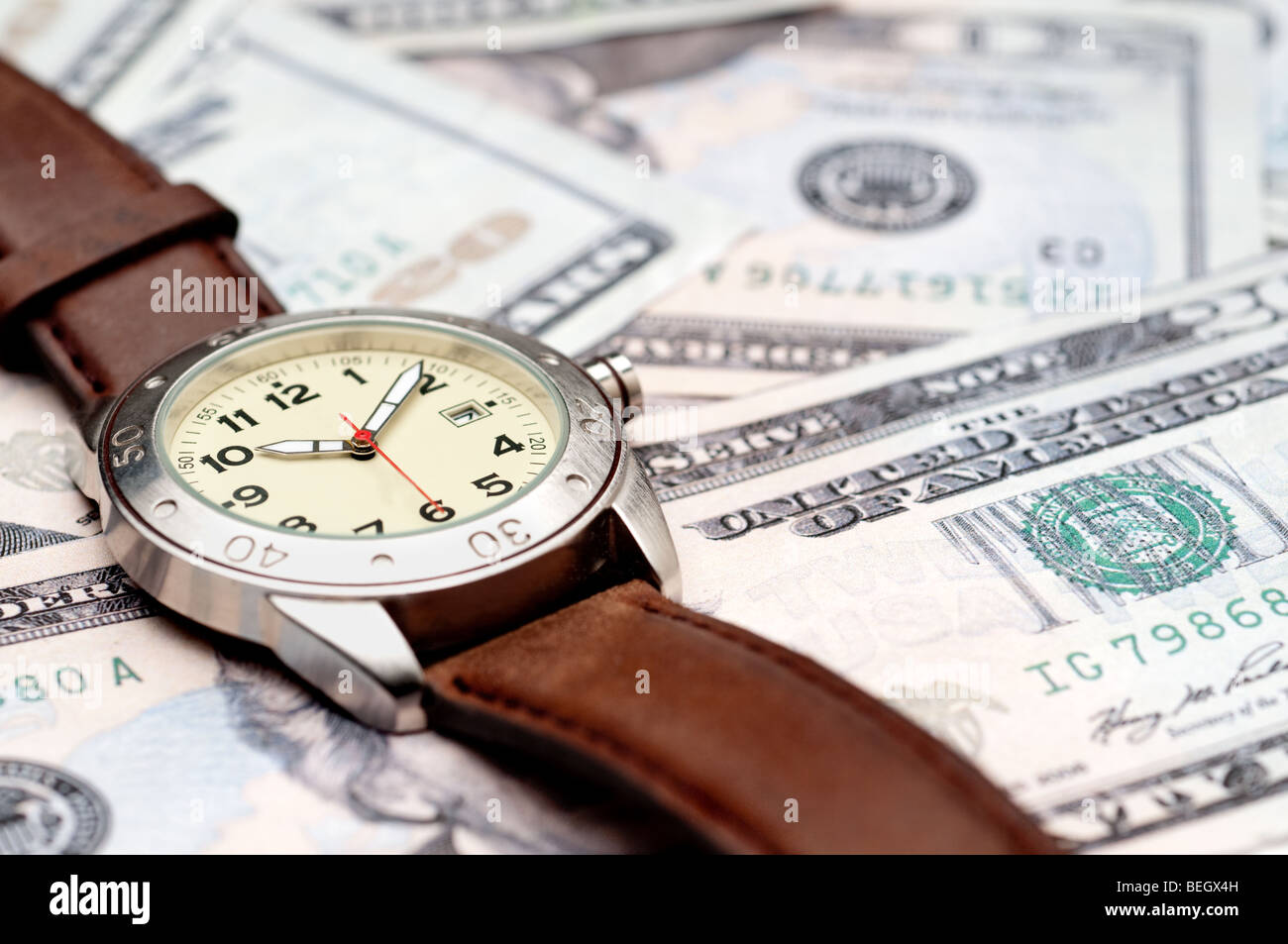 Horizontal image of a wristwatch on American currency Stock Photo