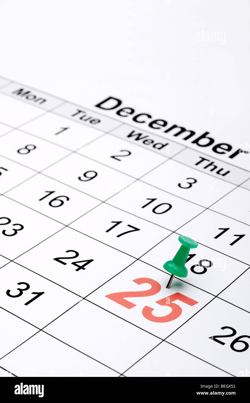 Vertical image of a calendar with Christmas day marked with a green