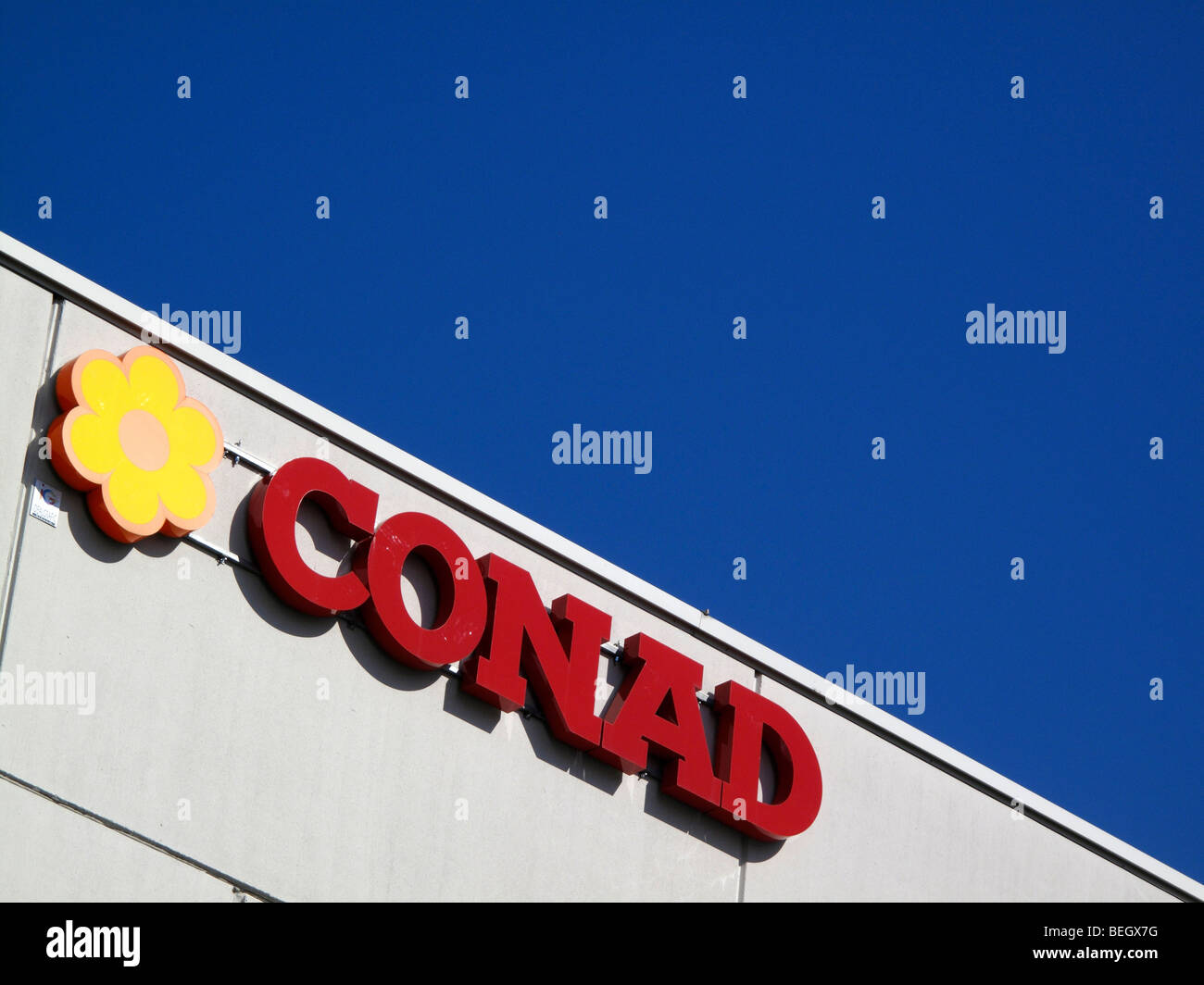 A storefront sign for a branch of the Italian supermarket chain Conad  Stock Photo