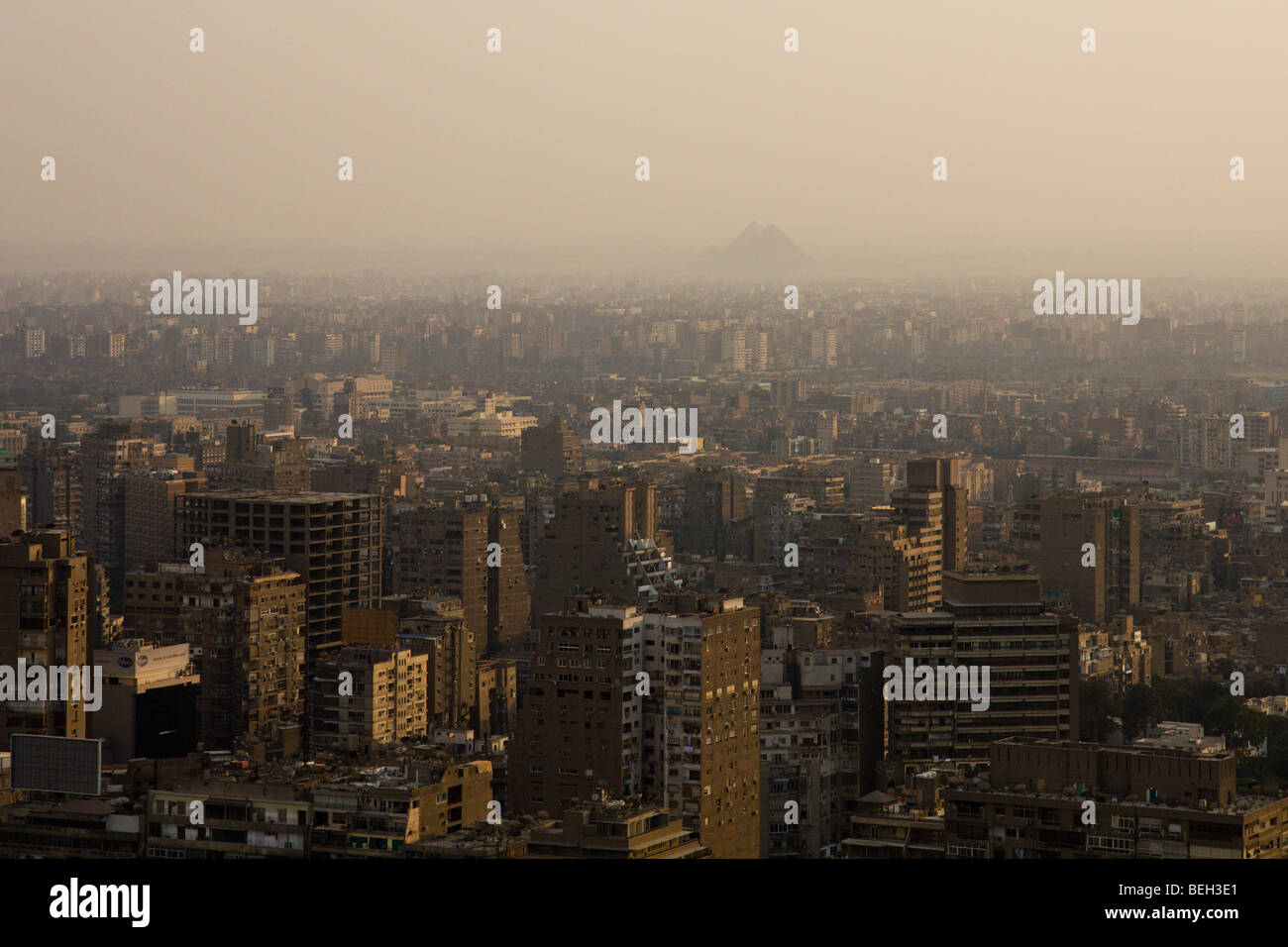 Smog over Cairo with Pyramids of Gizeh in Background, Cairo, Egypt Stock Photo
