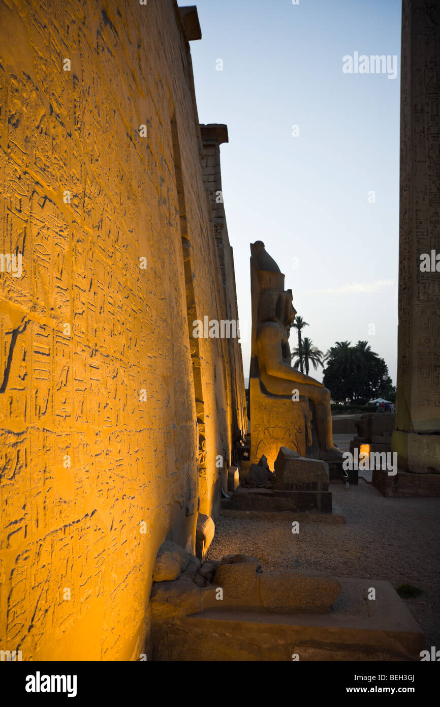 Illuminated Entrance of Luxor Temple with Ramesses II Statue, Luxor, Egypt Stock Photo