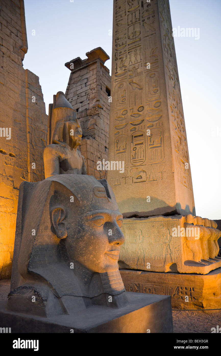 Illuminated Entrance of Luxor Temple with Ramesses II Statue and Obelisk, Luxor, Egypt Stock Photo