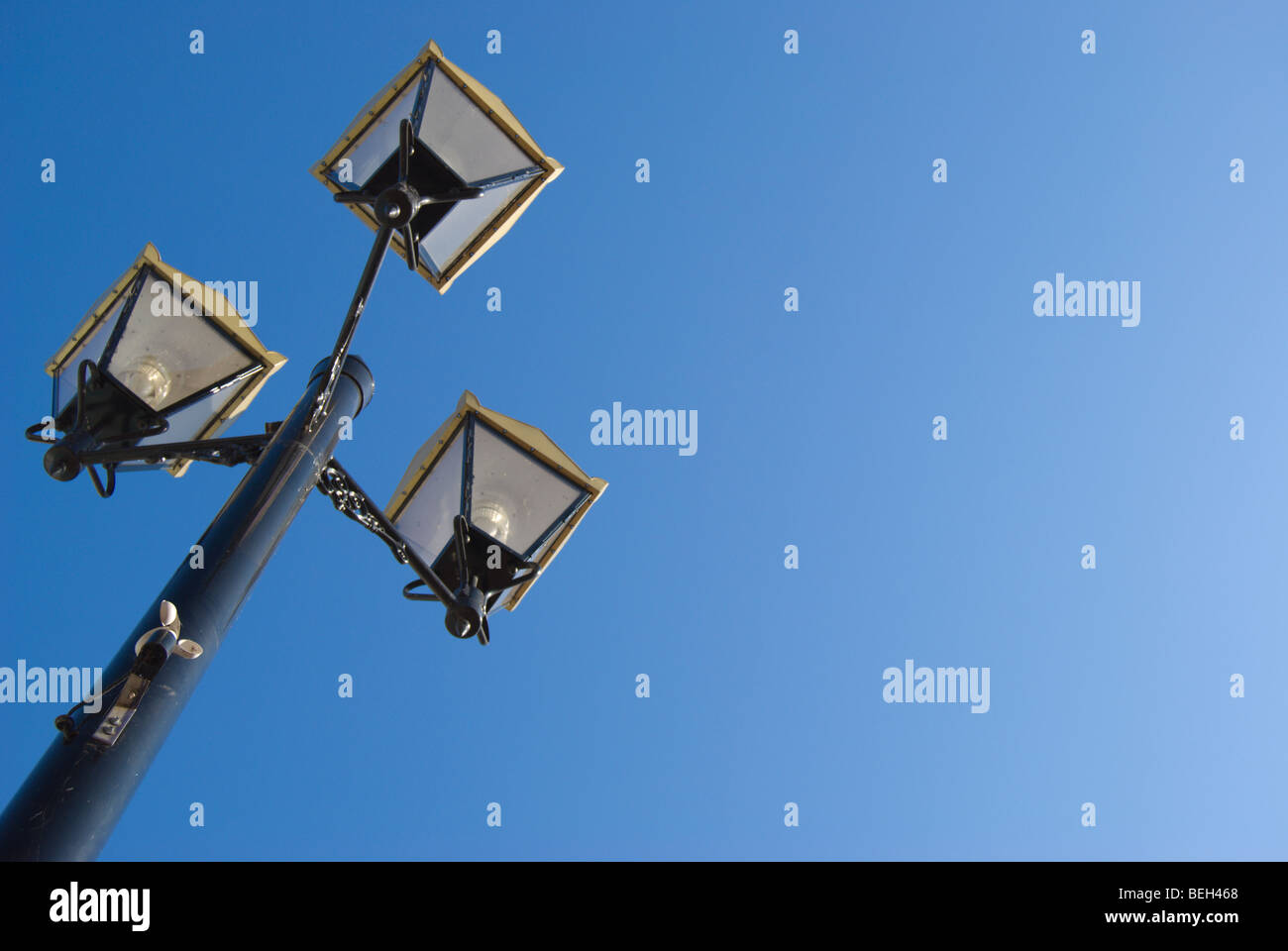 lamppost with three lamps and wind speed gauge on pole, in kingston