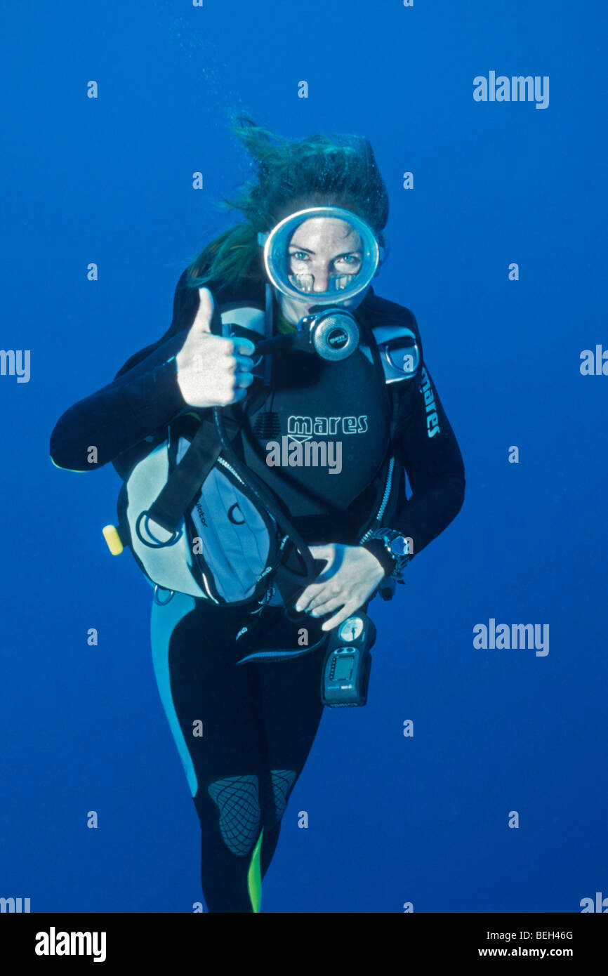 Diver shows Sign for Resurfacing Stock Photo