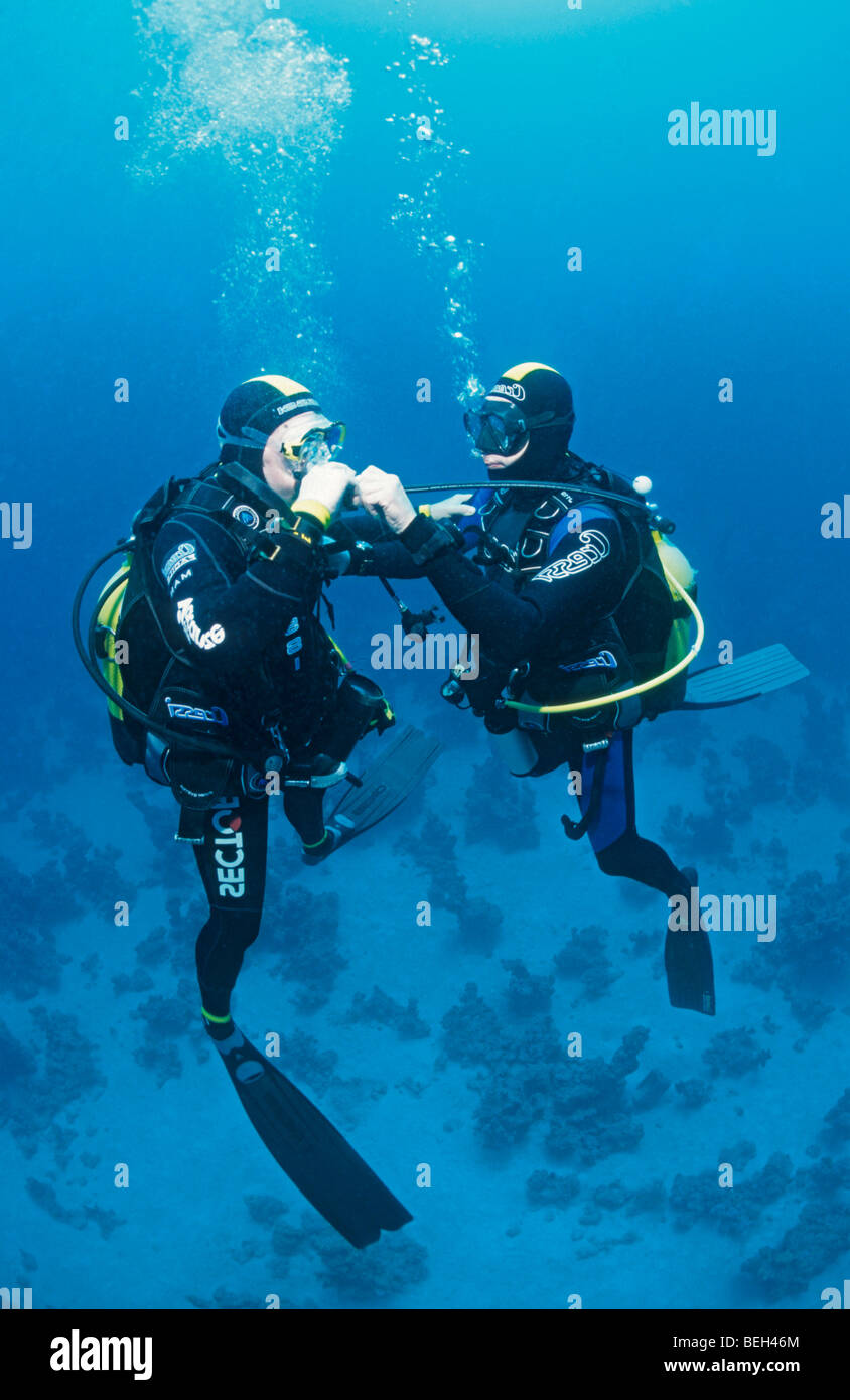 Diver practices Buddy Breathing Skill Stock Photo