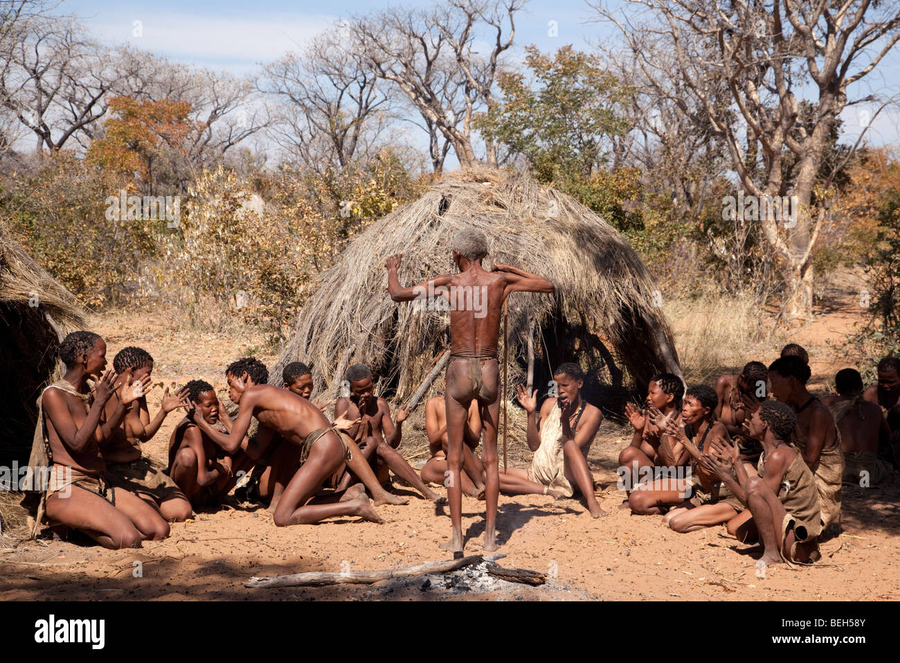 San village in Namiba on the edge of the Kalahari desert. The farewell dance, a hunter prepares to go out into the bush to hunt Stock Photo
