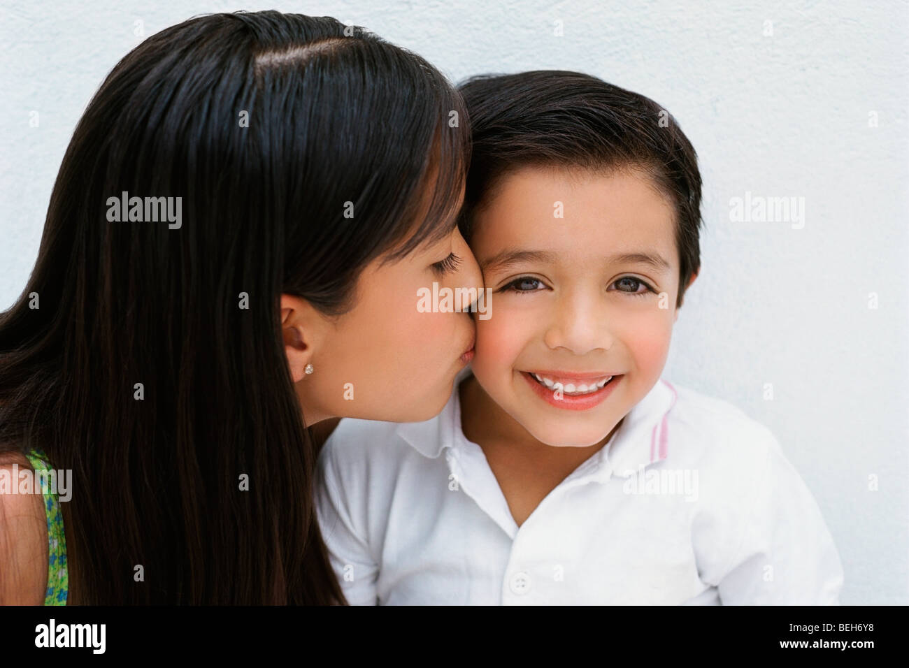 Close-up of a girl kissing her brother, Zacatecas, Mexico Stock Photo