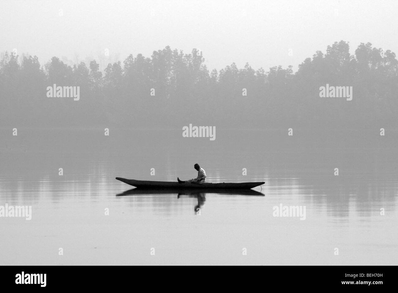 Fisherman in canoe, Bintan Bolong river, The Gambia Stock Photo