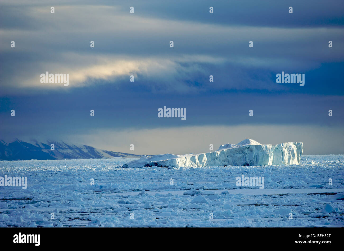 Spitsbergen, iceberg drifting in pack ice Stock Photo
