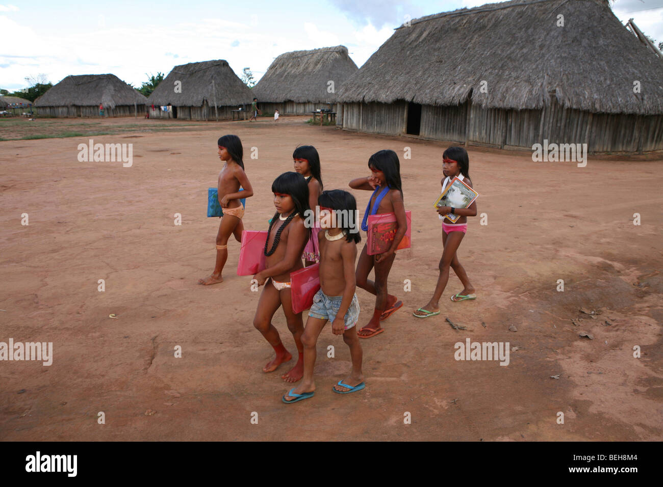 Children of the Xingu Indian go to school built in the village by the ministry of education. It is tradition to go in traditiona Stock Photo