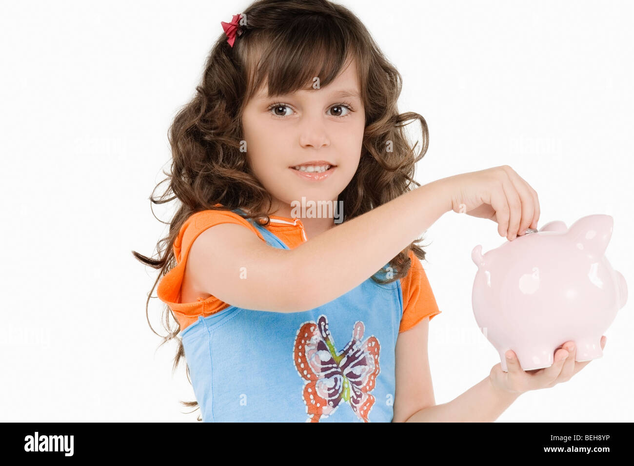 Girl 7 with piggy bank hi-res stock photography and images - Alamy