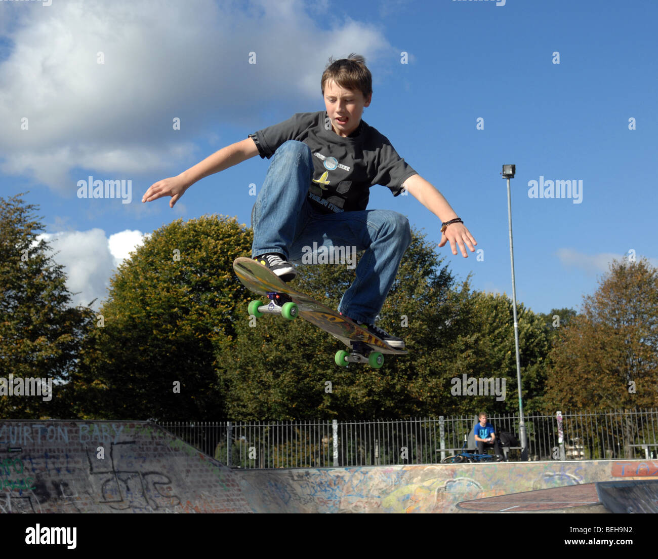 Kids playing in a skatepark . Stock Photo