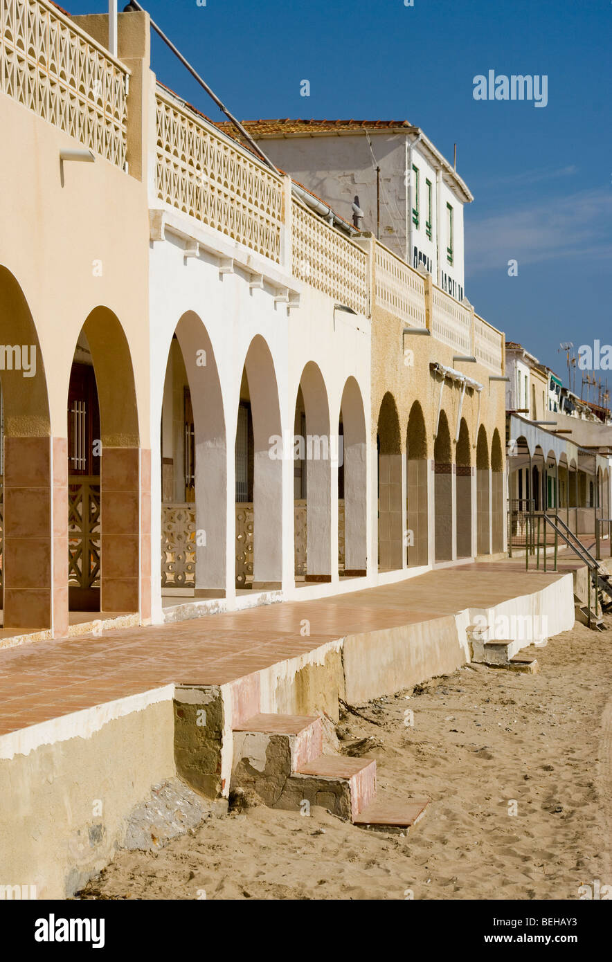 Arched Frontage Of Beachfront Holiday Villas Playa Del Pinet La Marina Spain Stock Photo