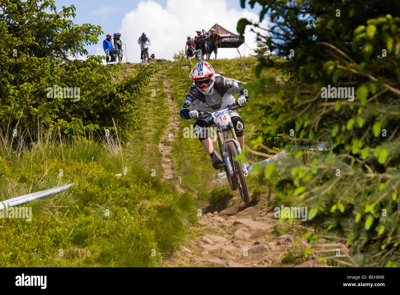 Rider at NPS (National Points Series) Downhill MTB (mountain bike) race in Ae forest Scotland Stock Photo