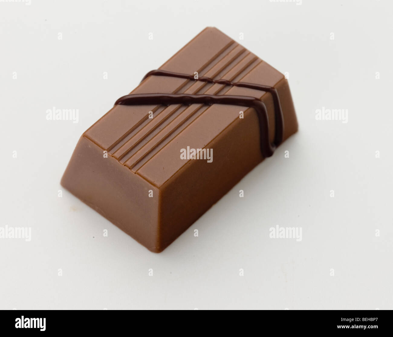 single gourmet milk chocolate praline Stock Photo Alamy