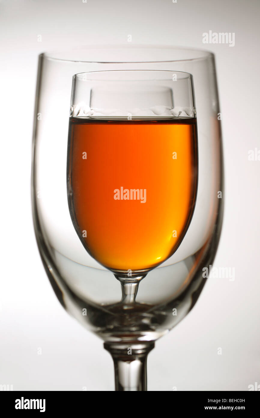 glasses of amber coloured beverage Stock Photo