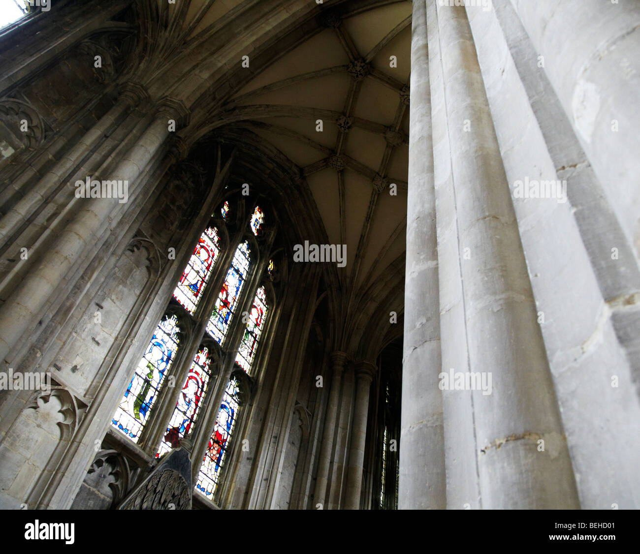 stone pillars stain glass windows Winchester Cathedral Stock Photo