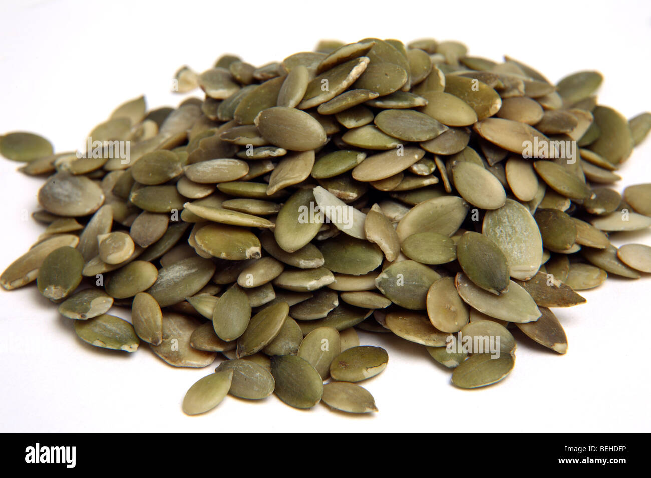 Shelled Pumpkin seeds on a white background Stock Photo Alamy